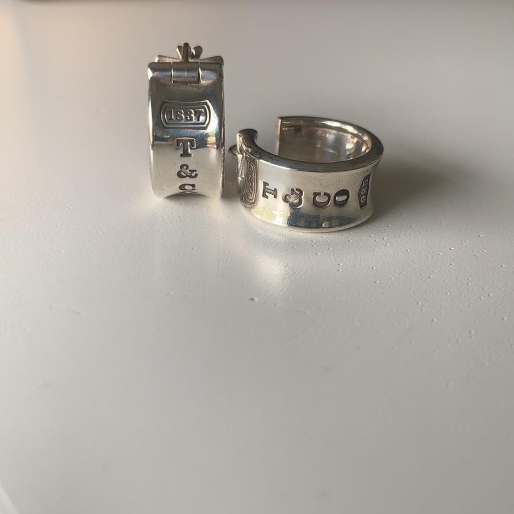 Tiffany and Co. mini hoop earring.